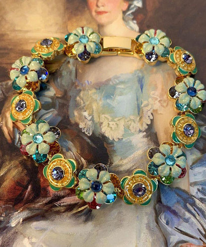 Damarmband med blommönster och kedjedetaljer 1