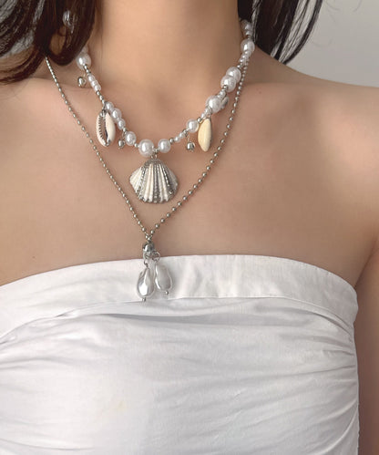 Damhalsband med dubbla lager och snäckskalspärla i modern design 0