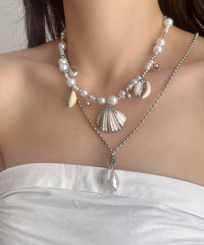 Damhalsband med dubbla lager och snäckskalspärla i modern design 2
