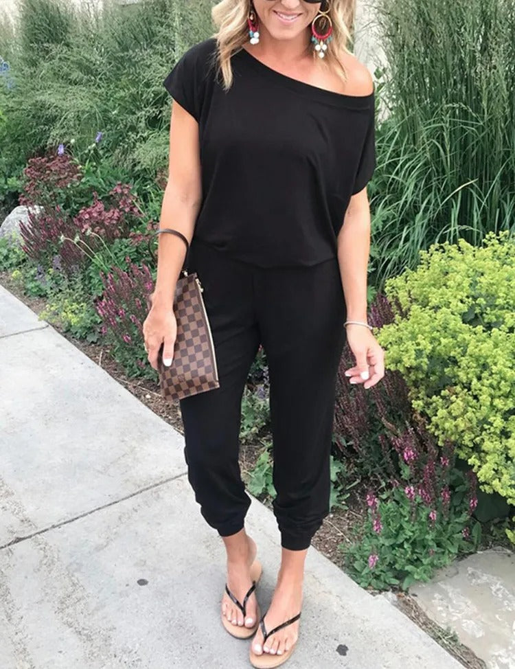 Lös jumpsuit med axelavslut för kvinnor