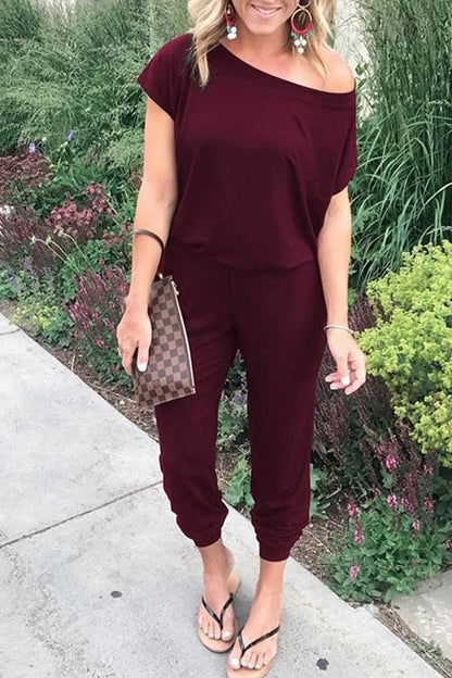 Lös jumpsuit med axelavslut för kvinnor