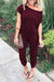 Lös jumpsuit med axelavslut för kvinnor