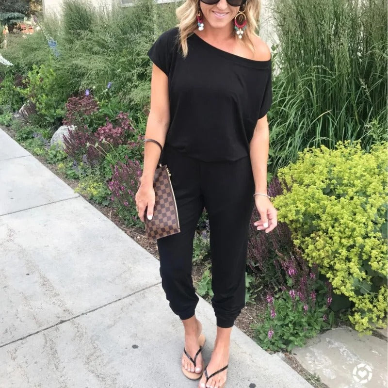 Lös jumpsuit med axelavslut för kvinnor