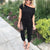Lös jumpsuit med axelavslut för kvinnor