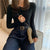 Knappstickad pullover för kvinnor