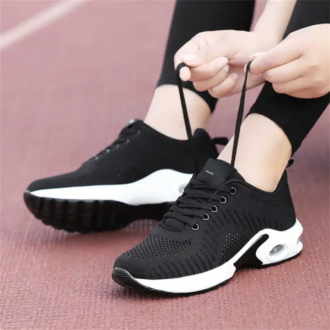 Friidrottsskor med hålfotsstöd för damer