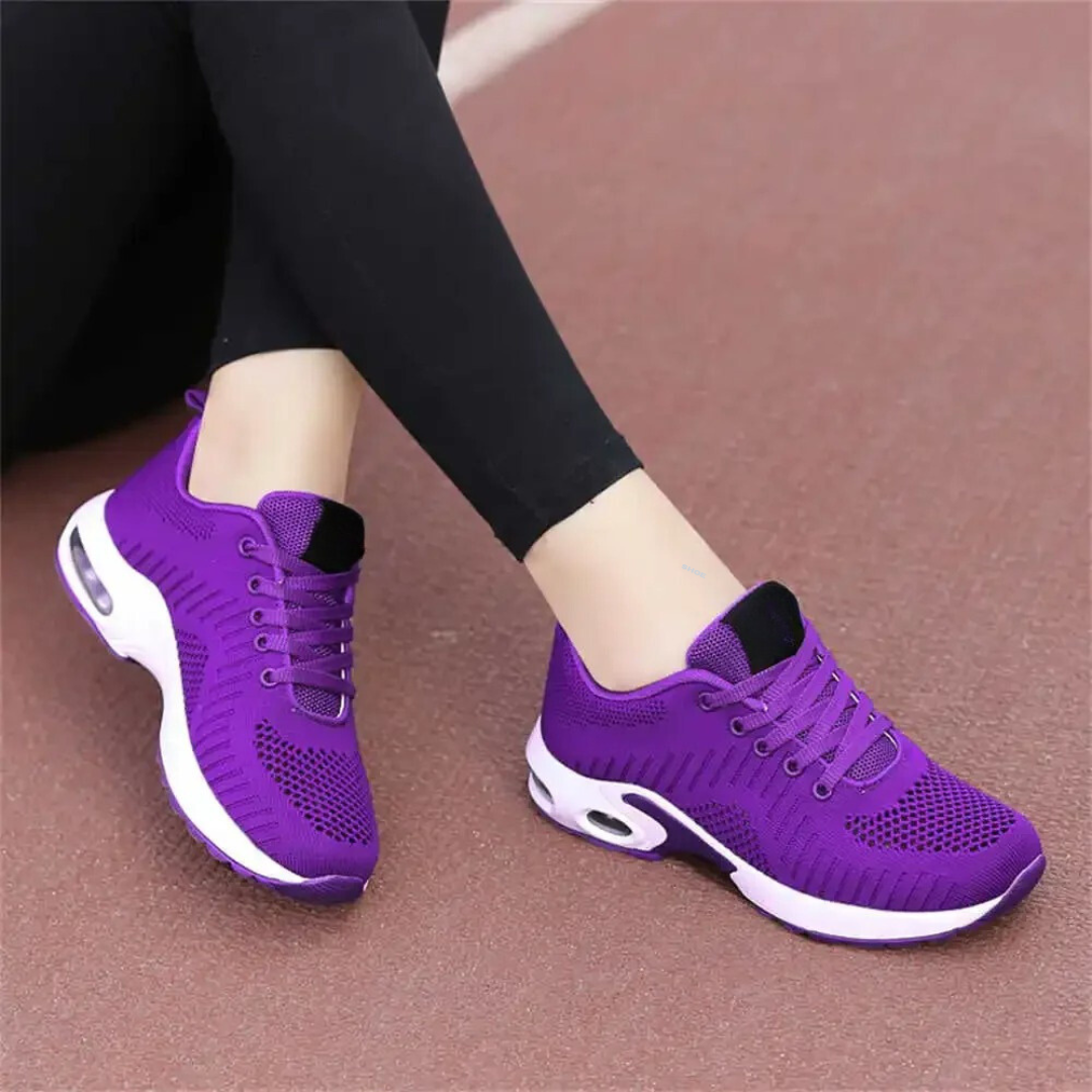 Friidrottsskor med hålfotsstöd för damer