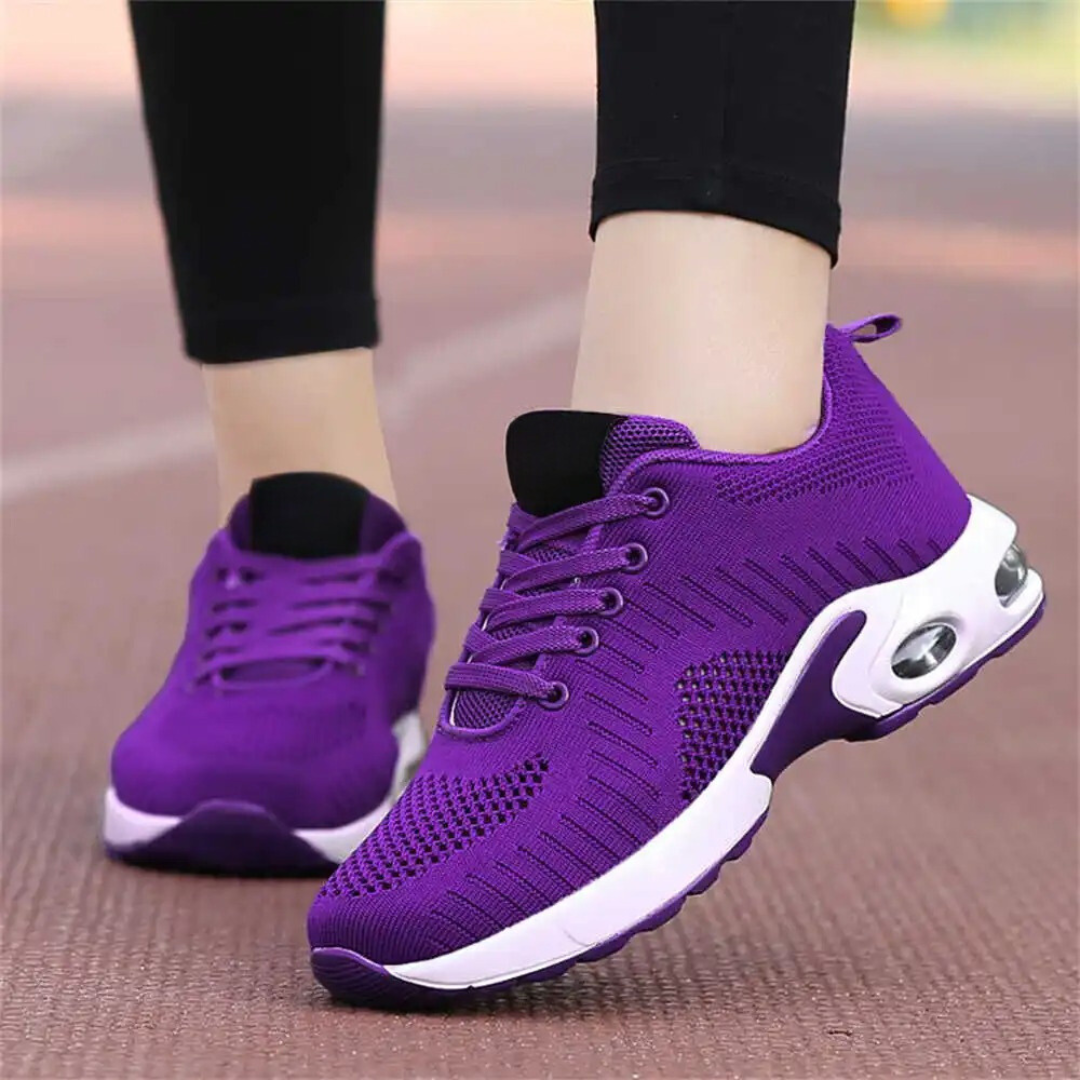 Friidrottsskor med hålfotsstöd för damer