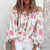 Blus med blommig ruffle ärm