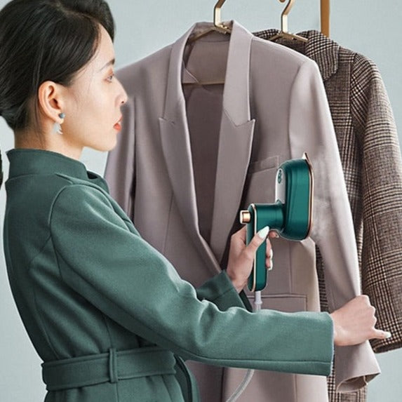 Handhållen ångstrykjärn